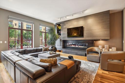 Expansive Living Room with custom furniture that is available for sale should the new owner wish.