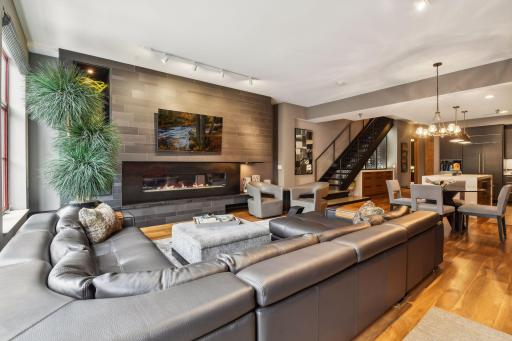 The architecturally designed fireplace/media wall in the Living Room sets the tone for this incredible modern home in Minneapolis' Mill District