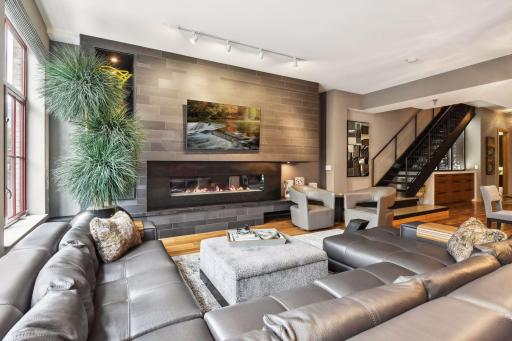 The architecturally designed fireplace/media wall in the Living Room sets the tone for this incredible modern home in Minneapolis' Mill District