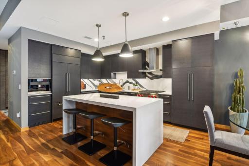 Stunning Modern Kitchen featuring the highest grade fixtures, appliances, custom cabinetry, and Cambria Quartz surfaces throughout