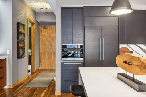 Stunning Modern Kitchen featuring the highest grade fixtures, appliances, custom cabinetry, and Cambria Quartz surfaces throughout