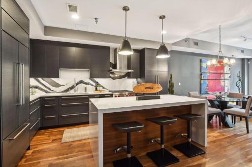 Stunning Modern Kitchen featuring the highest grade fixtures, appliances, custom cabinetry, and Cambria Quartz surfaces throughout