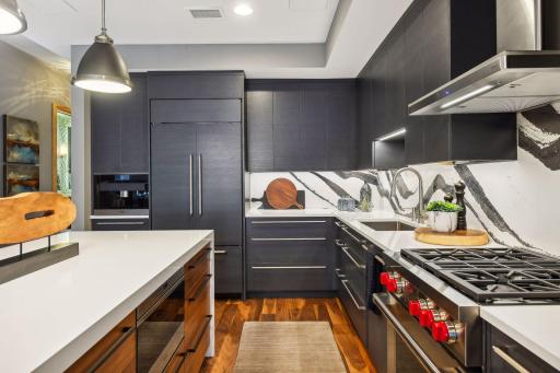Stunning Modern Kitchen featuring the highest grade fixtures, appliances, custom cabinetry, and Cambria Quartz surfaces throughout