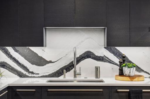 Stunning Modern Kitchen featuring the highest grade fixtures, appliances, custom cabinetry, and Cambria Quartz surfaces throughout