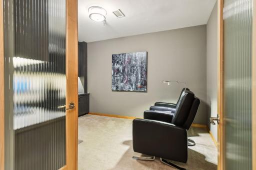 Second Bedroom with custom cabinetry built-in with flexibility to be a Home Office and large enough to accomodate a Queen bed/Sofa Sleeper/etc creating the perfect flex room