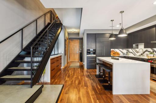 Main Level Kitchen and Wine Cellar to hall with Powder Bath and secondary Home Office