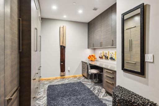 Main Level Home Office and/or additional guest space with cabinetry built-ins for Coats and Shoes and all of your storage needs