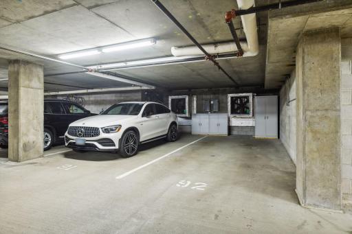 2 side-by-side large parking spaces with storage cabinetry