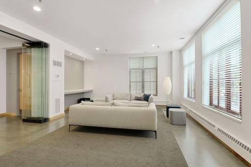 Lobby Level Community Room with seating and rotating artwork displayed
