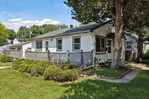Solid South St. Paul 3 bed, 2 bath home on corner lot with large deck, fenced yard and very rare 3 car heated garage!