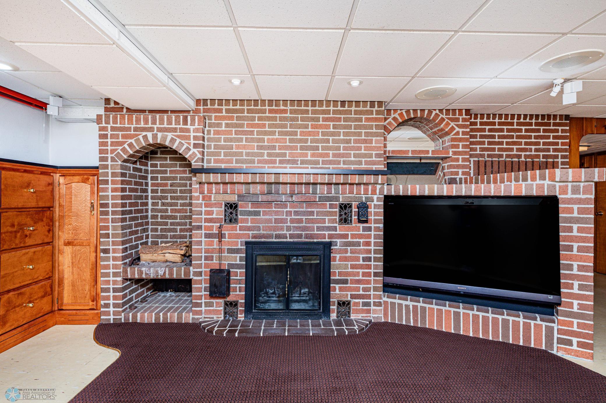 Basement Family Room Bricked Fireplace