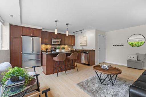 Welcome to 5412 France Ave #102! Featuring a beautiful kitchen w/stone counters, tile backsplash & stainless appliances including a brand new refrigerator