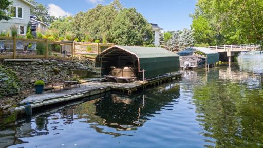 This home offers a permanent dock and slip that can hold two boats.