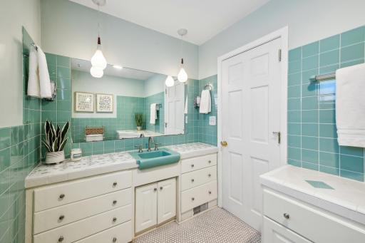 Main floor powder room is conveniently located off the living space.
