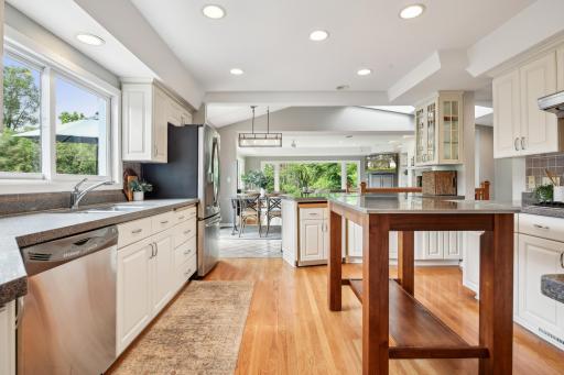 Open concept floor-plan surrounded by views of greenery and water.