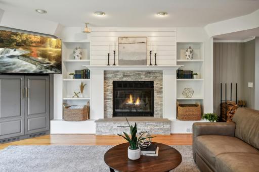 Cozy, wood burning fireplace invites you to relax.