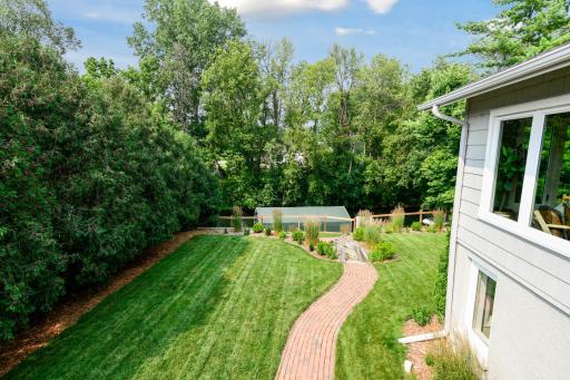 The design of the yard leading to the water allows for a beautiful functional and level backyard for activities, entertaining and play!
