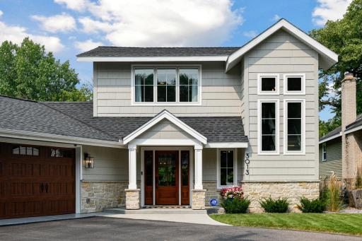 Recently renovated this Beautiful cement Board and stone exterior is a fabulous upgrade!