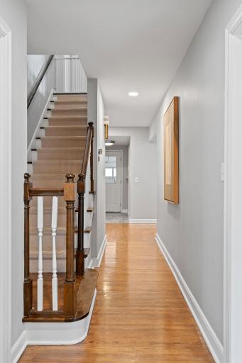 Stunning staircase with wood treads and carpet runner