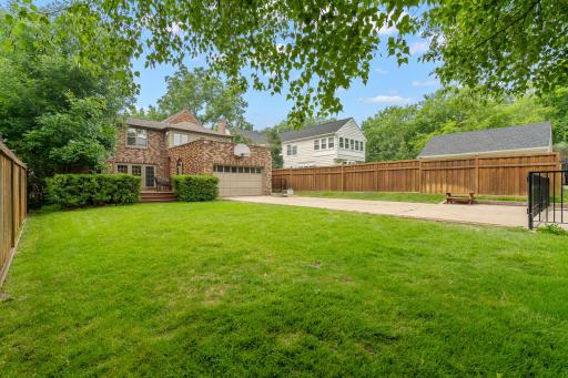 Fenced in backyard w/ multiple gates including the driveway