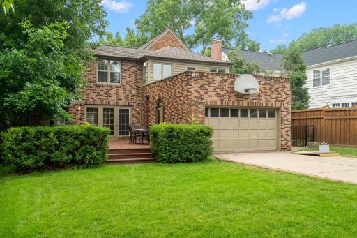 The alley gated entrance leads to the 2 stall attached garage, creating a magazine-quality setting.