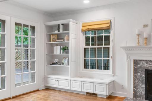 Other features include custom Roman shades, Oak hardwood flooring, built-in bookcase and window benches w/ storage