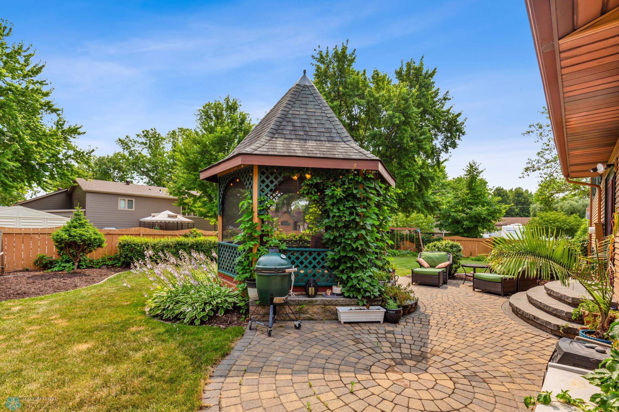Backyard with screened in gazebo