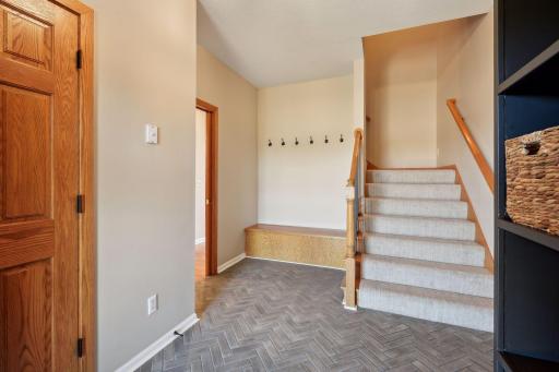 New ceramic tile in the mudroom to garage and back staircase