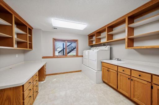 Expansive lower level laundry room. Easy to have a upper level laundry in the large mud room