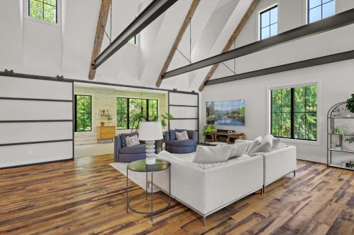 Soaring 28-foot vaulted ceiling with 1800's era hand-hewn oak beams, custom metal I-beams, and turnbuckles.