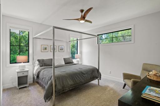 The main-level primary bedroom is a private oasis.
