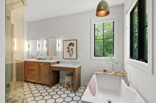 Luxurious private bathroom with heated tile floors.