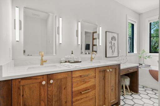 Gorgeous vanity with dual sinks and makeup vanity.