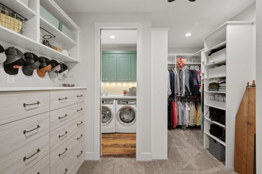 Primary bedroom walk-in closet with built-ins, and private access to the laundry room.
