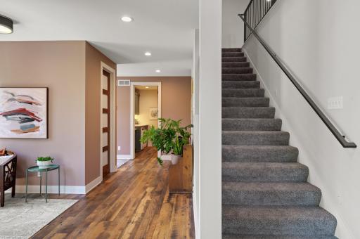 The mudroom offers a large walk-in closet and access to the attached 5-car garage with storage.