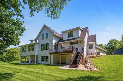 Enjoy the backyard on the dual covered patios or the maintenance-free deck overlooking the lush grass and mature trees.