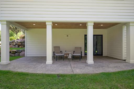 The rear patio is set up with a 50A 220V power supply for a future hot tub, along with a TV/fan rough-in.