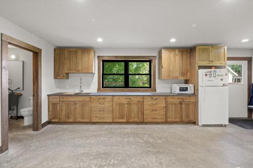 It is heated and air-conditioned with in-floor heat, additional double mini-split system with humidity control, Andersen windows, and kitchenette.