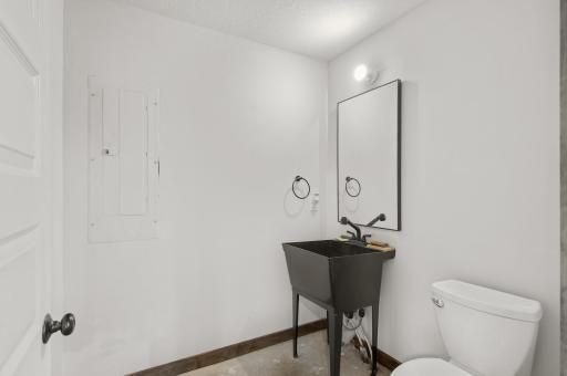 Outbuilding also features a convenient powder room.
