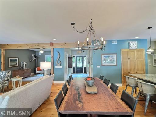 The dining room is centrally located, this shows a view to the foyer area where the stairs leads to the 2nd level.