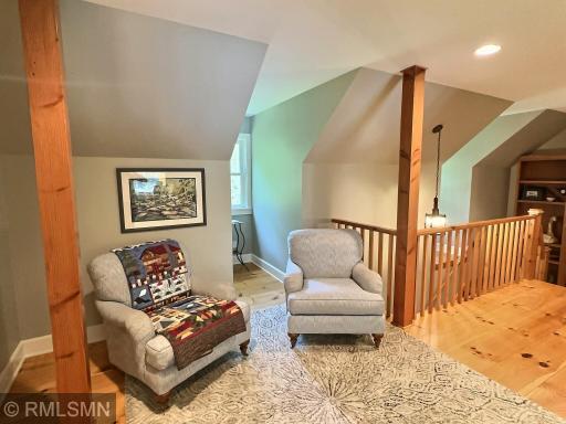 Venture upstairs and be greeted with a cute den showcasing two dormers with nooks and wood floors.