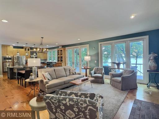 Expansive windows flood the thoughtfully designed home with natural light featuring gorgeous touches.