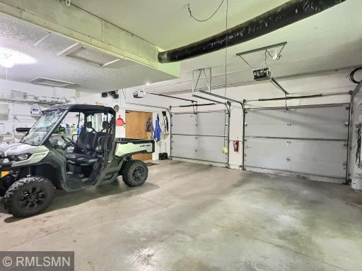 The detached garage/bunkhouse offers storage shelving and two parkings spots just steps away from the home.