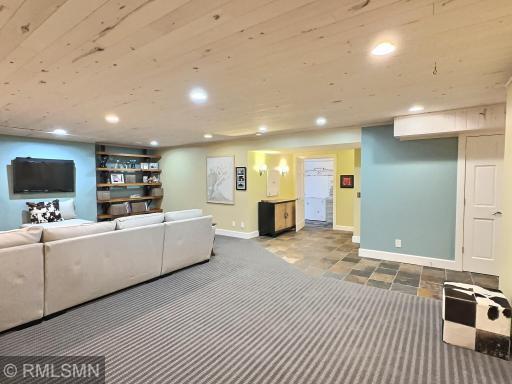 The family room offers wood ceilings and opens to the hallway finished with slate flooring, you'll all the space.