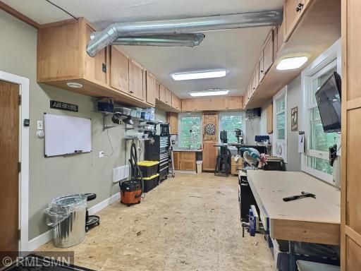 Below the bunkhouse is a workshop offering tons of cabinets and window...great spot to work on your skills.