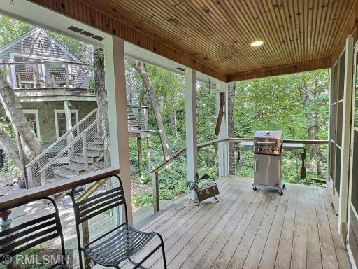 Just off the screened in porch is this covered deck, perfect for grilling even on those rainy spring days.