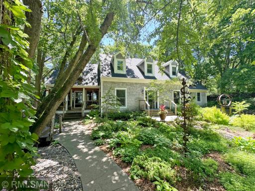 Tucked in the trees, where rustic-modern aesthetic character perfectly complements the wooded shores.