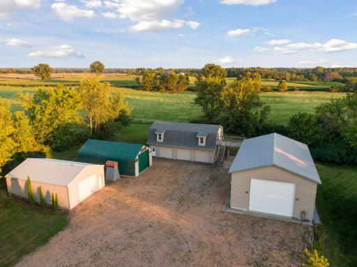4 out buildings. Huge pole barn/boat house w/workshop area, loft and heated floors, large studio/fitness space w/parking stalls and bathroom (carriage house), tons of storage space for toys, boats, vehicles, projects