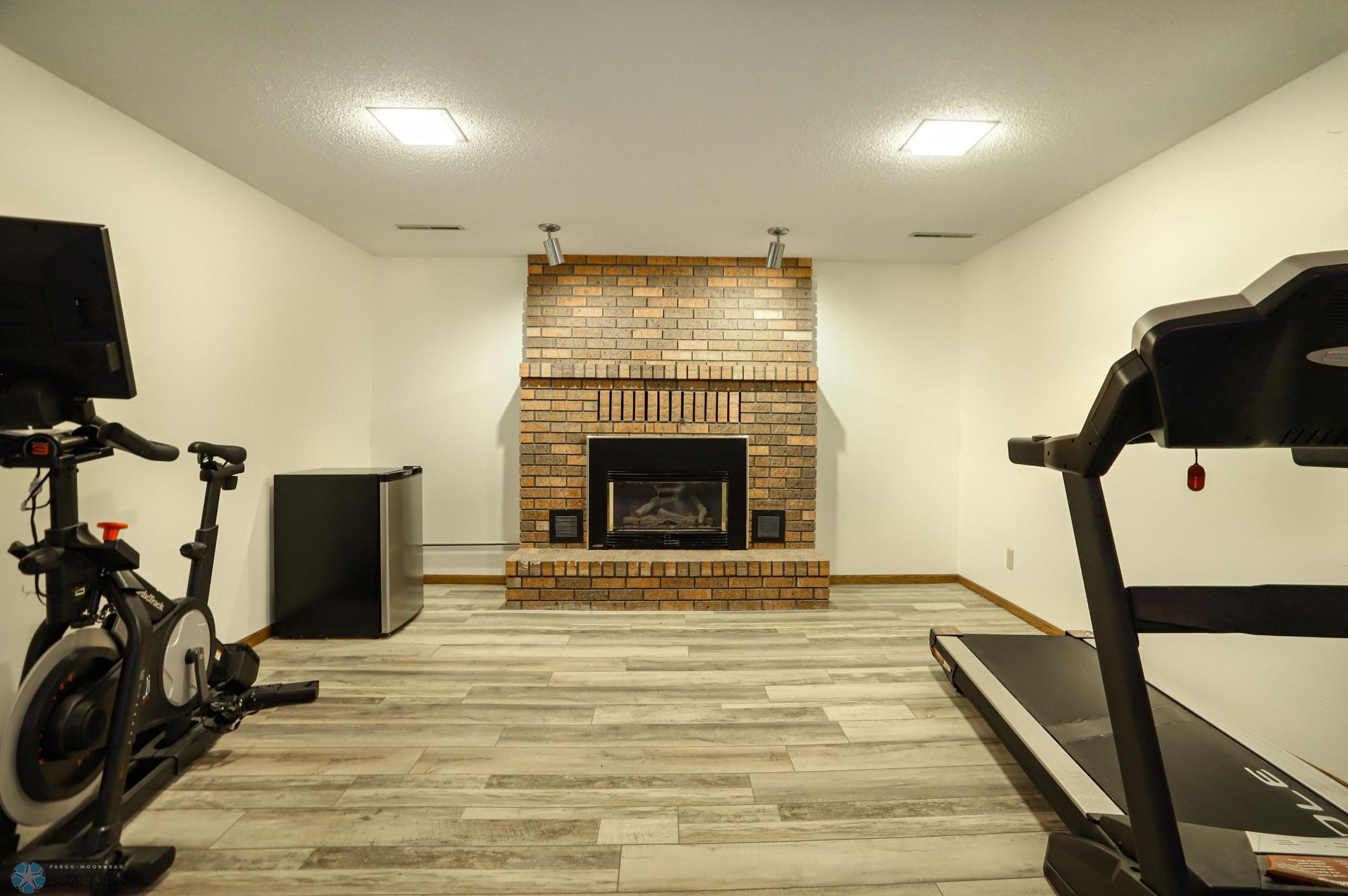 Sitting room in basement with gas Fireplace