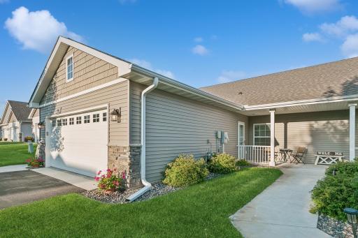 Two front entrances~ This one walks into the laundry room and has a darling front porch.